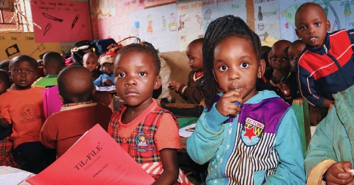 A group of young children engaged in an educational activity in a colorful classroom.